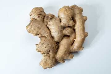 Fresh organic ginger rhizome root used in traditional medicines and for flavoring meals, drinks,...