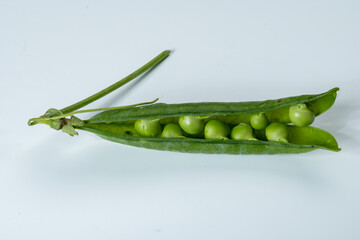 New harvest of fresh ripe green peas legumes