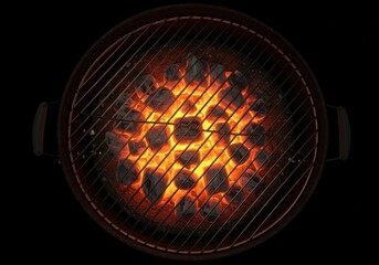 Top-down view of circular barbecue grill with glowing hot charcoal and flames