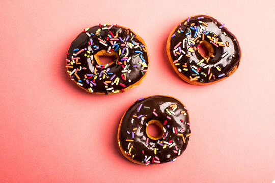 Chocolate gazed donuts with sprinkles