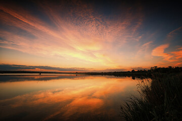 Serene sunset over a calm lake