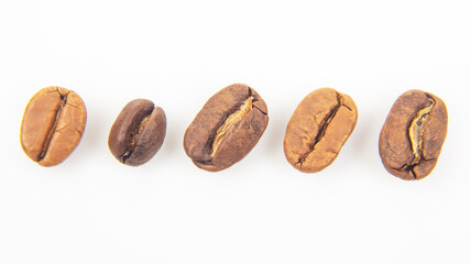 High-resolution image of a roasted coffee bean, showing its natural cracks and glossy finish. Perfect for coffee industry promotions or recipe websites