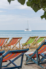 Thailand. Koh Chang. Beach chairs by the sea.