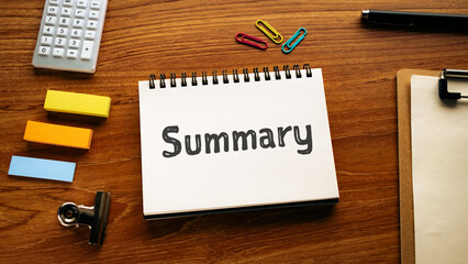 There is notebook with the word Summary. It is as an eye-catching image.