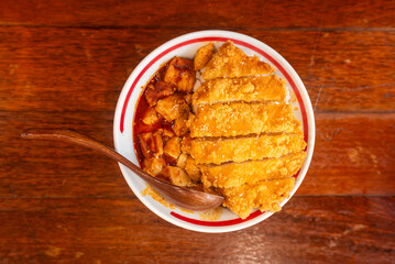 Savor the mouthwatering and delicious Chicken Cutlet served with rich sauce in a bowl