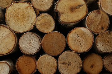 Fototapeta premium Stack of cut firewood as background, closeup view