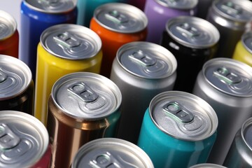 Many aluminium cans of beverage as background, closeup