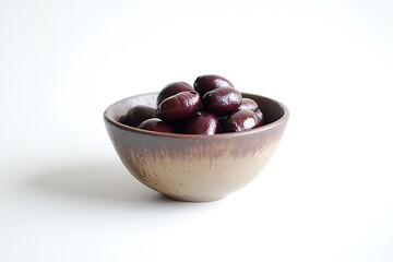 Obraz premium Bowl of Fresh Kalamata Olives with Glossy Texture on a White Surface