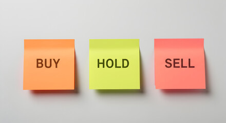Buy Hold Sell Colored Sticky Notes Arranged Horizontally on a Light Gray Background Stock Photo