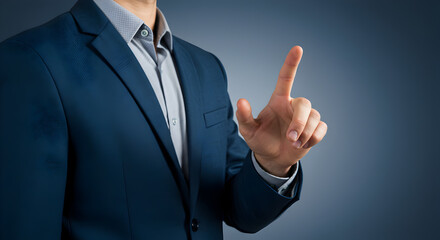 Man in Blue Suit Pointing with Finger on Dark Gradient Background