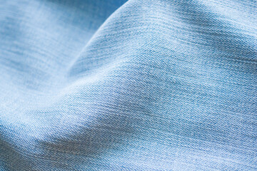 Old denim blue jeans fabric texture background close up