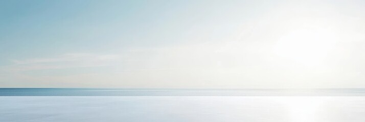 Fototapeta premium Serene coastal landscape at sunrise, showcasing a calm sea reflecting soft light with gentle waves, creating a peaceful atmosphere ideal for relaxation and mindfulness