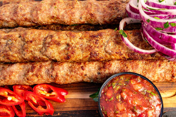 Freshly grilled kabobs served with spicy sauce and onion