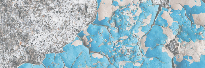 Blue peeling paint on the wall. Old concrete wall with cracked flaking paint. Weathered rough painted surface with patterns of cracks and peeling. High resolution texture for background and design.