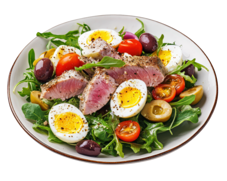 fresh salad featuring seared tuna, boiled eggs, olives, and cherry tomatoes on bed of arugula, creating vibrant and healthy meal