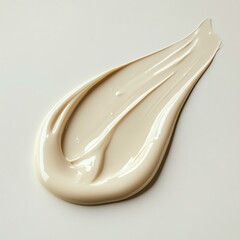 Smooth beige paint texture on a white background.