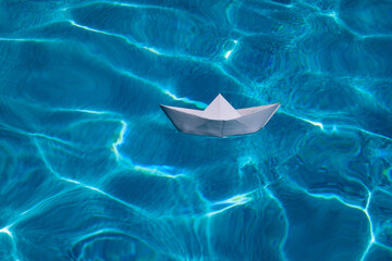 Paper boat , origami paper ship on the sea background. Tourism, travel dreams vacation holiday....
