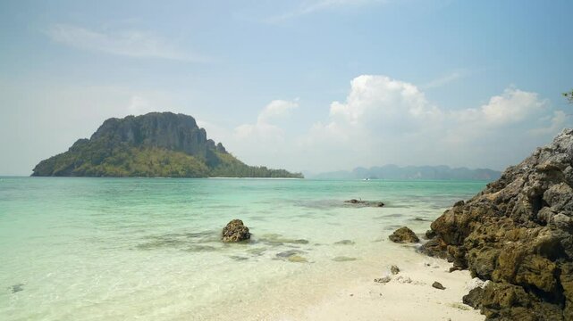 blue sea from another view of koh thale waek tub islands ko more and chicken island at Krabi in Thailand with rocks stones on beach for summer holiday travel to nature ocean marine and tourist boat