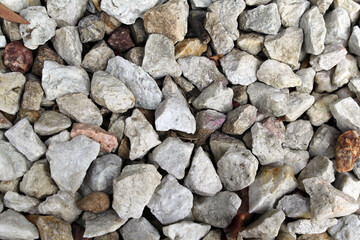 Close up textured abstract background of gravel rocks stones
