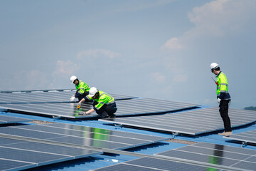 Engineer team installs solar cells check installation solar cell on the roof Sustainable energy industry concept Renewable energy solutions for climate change..