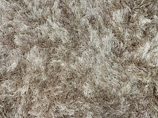 Close up of carpet rug flooring in tuft bump map texture in grey and gold brown color. Seamless...