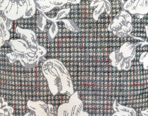 Close up of grey and white fabric with random flower and leaves illustration with monochrome...
