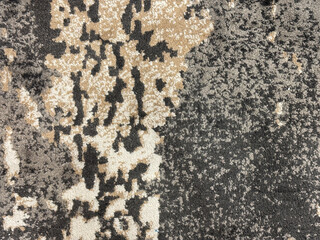Close up of decorative carpet rug or fabric in random grunge and dirt texture. Black and white...