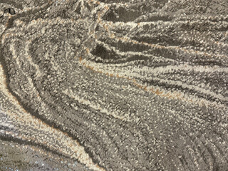 Graphic background in abstract illustrated cloud, brushed, and wavy pattern. Painted in blue, brown, grey, and beige color. Random grunge and dirt carpet rug seamless background texture