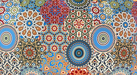 Close up of colorful vibrant Morocco and Islamic middle eastern ornamental graphic background. Indian, Mughal, Arabic and middle east design pattern. Wallpaper and fabric. Seamless background texture.
