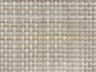Close up photo of hand woven rattan texture in white beige color. Wicker art or rattan weaving art pattern in many shapes. Seamless texture.