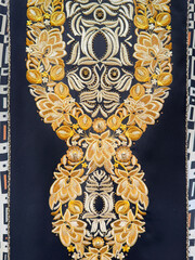 Graphic black background with random ornamental design and lace engraving, in gold color. Suitable for luxurious ethnic and traditional pattern for fabric and wallpaper. Seamless background texture.