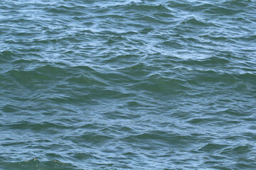 Ripples on top of the ocean sea water surface
