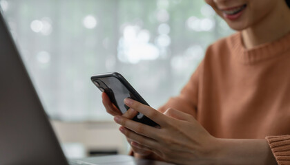 hand holding smartphone device and typing text message on online social.