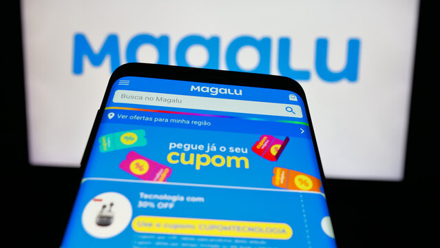 Stuttgart, Germany - 03-24-2025: Mobile phone with logo of retail company Magazine Luiza S.A. (Magalu) on screen in front of website. Focus on top-left of phone display.