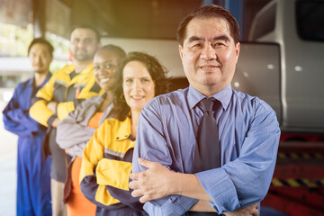 Businessman, salesman, car mechanic and workers standing together with crossed arms and smiling in auto repair car service. Small business, startup and garage