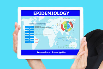 Hand holding digital tablet showing epidemiology research analysis result on screen.
