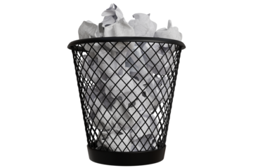 Crumpled papers overflowing a wire trash can