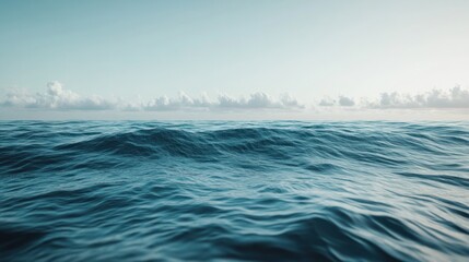 Fototapeta premium Serene Ocean Vista with Gentle Waves Under a Pale Sky Horizon