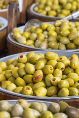 Fresh green olives in barrels. Traditional Greek addition to dishes