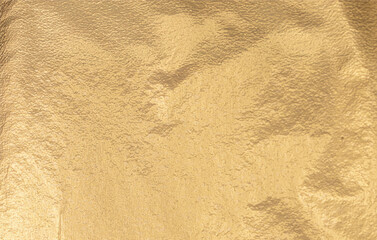 Gold and yellow foil background with sleek metallic texture and soft matte finish. Elegant, shiny...