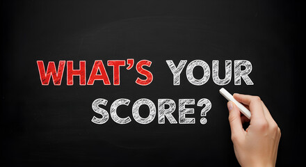 Fototapeta premium Human Hand Writing What is Your Score on Dark Blackboard with Chalk for Educational Concept