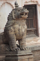 picture of lion statue made from stone or bronze