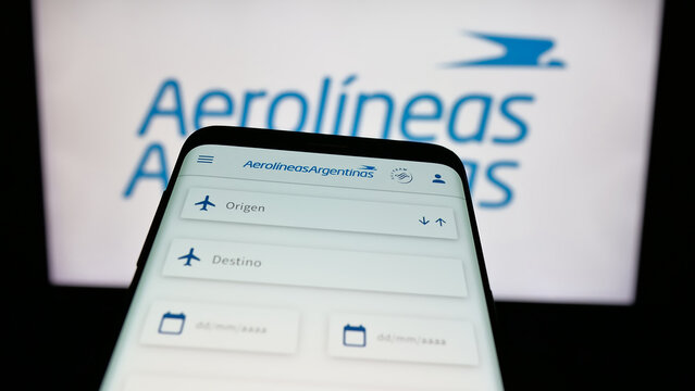 Stuttgart, Germany - 03-27-2025: Mobile phone with logo of airline company Aerolineas Argentinas S.A. on screen in front of website. Focus on top-left of phone display.