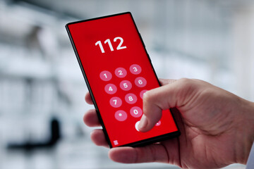 Hispanic Man Dialing 112 For Emergency Aid