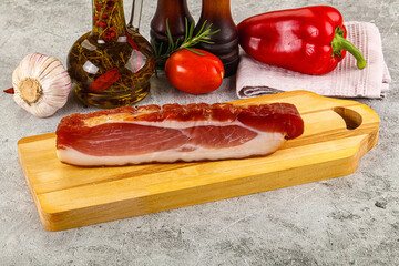 Piece prosciutto crudo over board