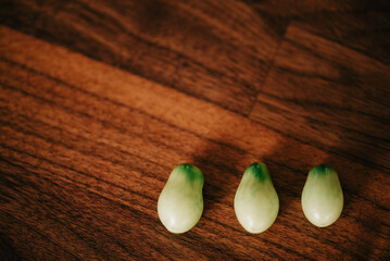Fresh-picked Roma tomatoes from the garden on a wooden surface