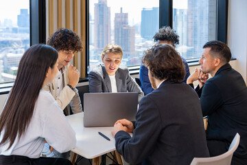 Team of diversity business people are discussing over the new strategic strategy project on investment real estate while working in modern office building for new project and planning usage