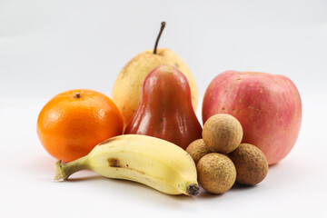  Assorted fruits stacked together on flat surface