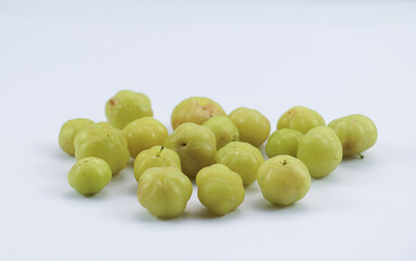 Fresh star gooseberries on a white surface