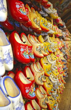 Typical Dutch clogs on sale on the flower market in Amsterdam, Netherlands. Rack in the store with rows traditional dutch wooden shoes - klompen